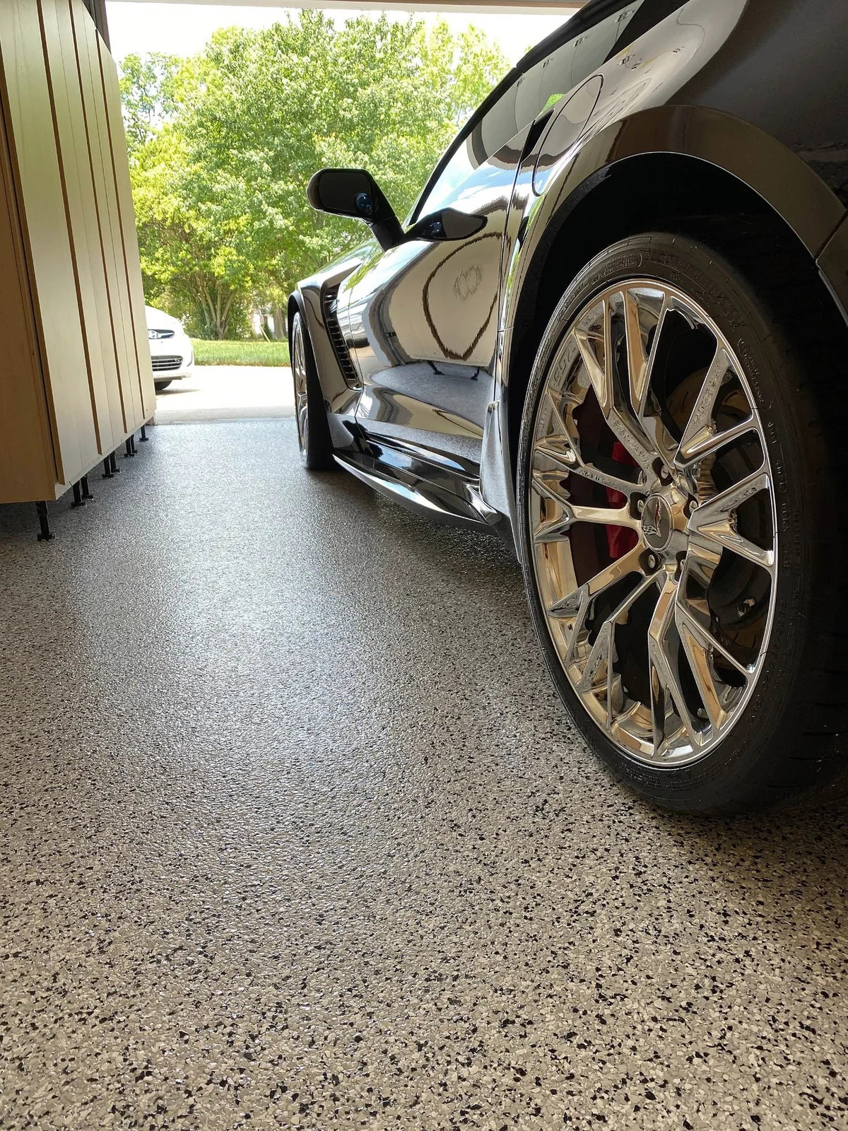 Performance car parked on a professionally coated garage floor